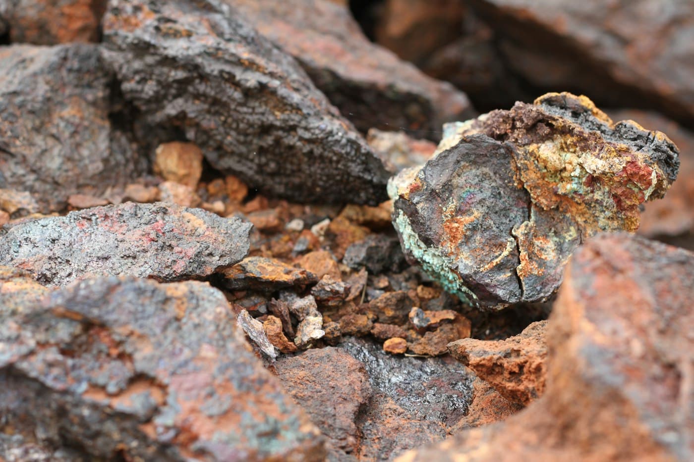 Close-up of raw metallic mineral ore in warm earth tones
